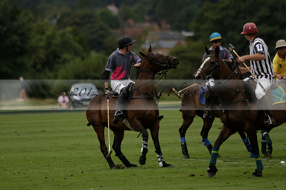 La Tremenda (lilac) v Maiz Dulce (yellow) in a Brecknock Cup polo match played on Lawns 1 at the Cowdray Park Polo Club on Tuesday 13 August 2013