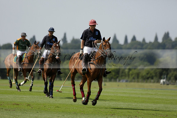 Maiz Dulce (green) v River (blue) in a Uber Polo Midsummer 12 goal polo match on Wednesday 21 August 2013 at Cowdray park Polo Club on Ambersham 2.  www.polopictures.co.uk