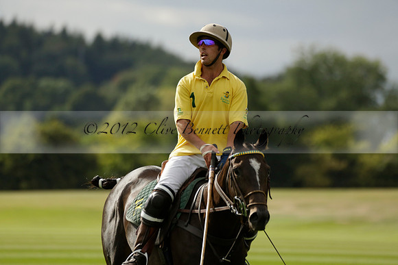 La Tremenda (lilac) v Maiz Dulce (yellow) in a Brecknock Cup polo match played on Lawns 1 at the Cowdray Park Polo Club on Tuesday 13 August 2013