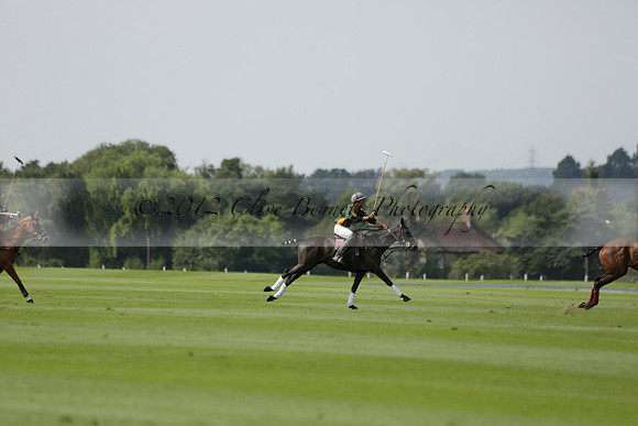 Maiz Dulce (green) v River (blue) in a Uber Polo Midsummer 12 goal polo match on Wednesday 21 August 2013 at Cowdray park Polo Club on Ambersham 2.  www.polopictures.co.uk