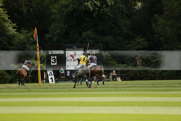 La Tremenda (lilac) v Maiz Dulce (yellow) in a Brecknock Cup polo match played on Lawns 1 at the Cowdray Park Polo Club on Tuesday 13 August 2013