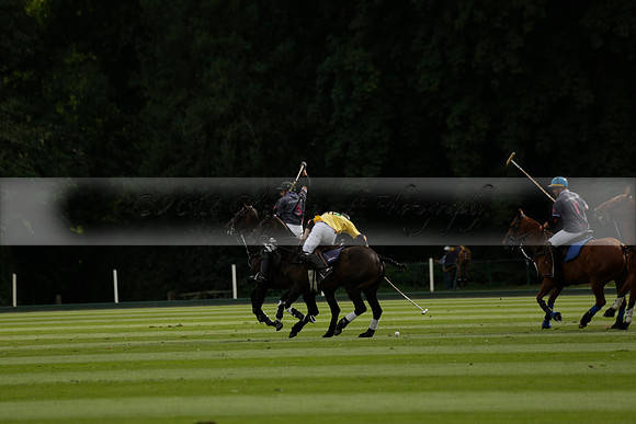 La Tremenda (lilac) v Maiz Dulce (yellow) in a Brecknock Cup polo match played on Lawns 1 at the Cowdray Park Polo Club on Tuesday 13 August 2013
