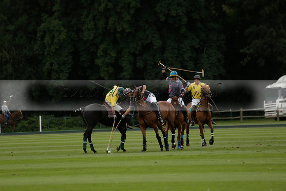 La Tremenda (lilac) v Maiz Dulce (yellow) in a Brecknock Cup polo match played on Lawns 1 at the Cowdray Park Polo Club on Tuesday 13 August 2013