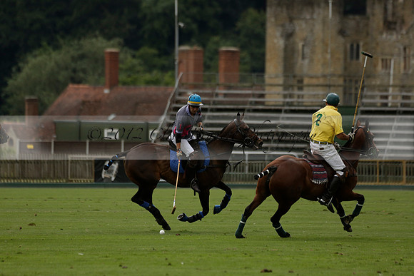 La Tremenda (lilac) v Maiz Dulce (yellow) in a Brecknock Cup polo match played on Lawns 1 at the Cowdray Park Polo Club on Tuesday 13 August 2013