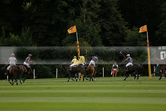 La Tremenda (lilac) v Maiz Dulce (yellow) in a Brecknock Cup polo match played on Lawns 1 at the Cowdray Park Polo Club on Tuesday 13 August 2013
