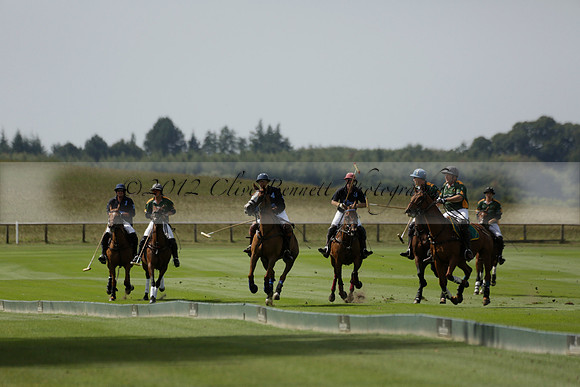 Maiz Dulce (green) v River (blue) in a Uber Polo Midsummer 12 goal polo match on Wednesday 21 August 2013 at Cowdray park Polo Club on Ambersham 2.  www.polopictures.co.uk