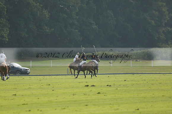 Pluma Negra (white) v Shoreline (black) in the Brecknock Cup Subsidiary final polo match played on Sunday 25 August 2013 at Cowdray Park Polo Club on Ambersham 1. 2013.10.12 www.polopictures.co.uk