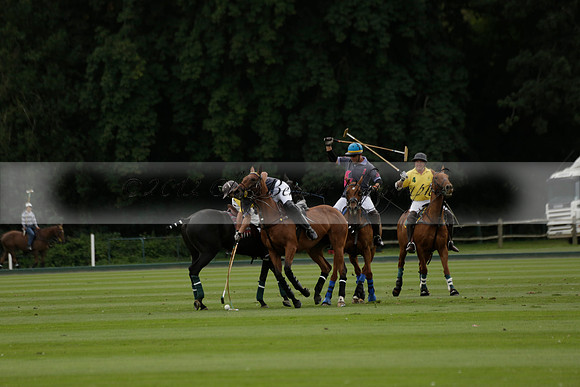 La Tremenda (lilac) v Maiz Dulce (yellow) in a Brecknock Cup polo match played on Lawns 1 at the Cowdray Park Polo Club on Tuesday 13 August 2013