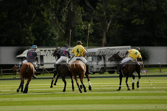 La Tremenda (lilac) v Maiz Dulce (yellow) in a Brecknock Cup polo match played on Lawns 1 at the Cowdray Park Polo Club on Tuesday 13 August 2013