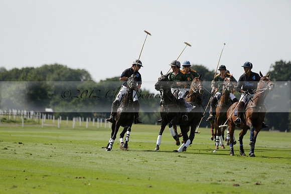 Maiz Dulce (green) v River (blue) in a Uber Polo Midsummer 12 goal polo match on Wednesday 21 August 2013 at Cowdray park Polo Club on Ambersham 2.  www.polopictures.co.uk