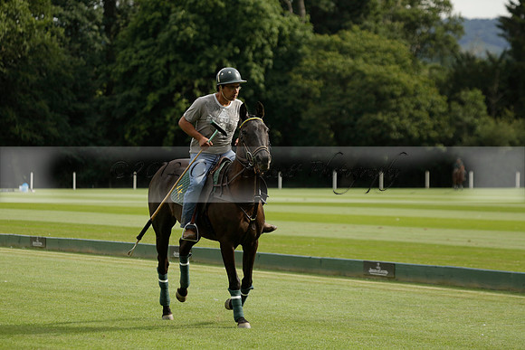 La Tremenda (lilac) v Maiz Dulce (yellow) in a Brecknock Cup polo match played on Lawns 1 at the Cowdray Park Polo Club on Tuesday 13 August 2013