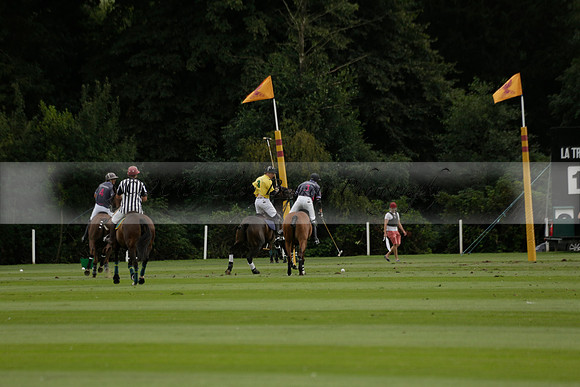 La Tremenda (lilac) v Maiz Dulce (yellow) in a Brecknock Cup polo match played on Lawns 1 at the Cowdray Park Polo Club on Tuesday 13 August 2013