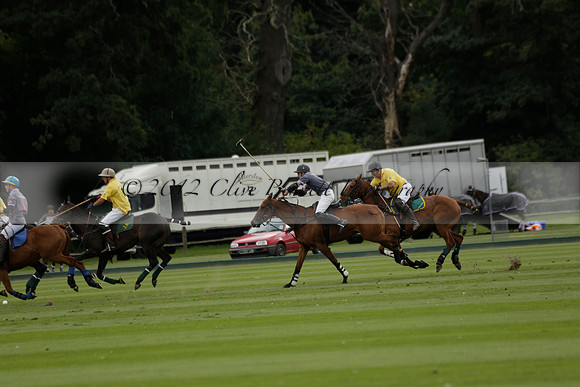 La Tremenda (lilac) v Maiz Dulce (yellow) in a Brecknock Cup polo match played on Lawns 1 at the Cowdray Park Polo Club on Tuesday 13 August 2013