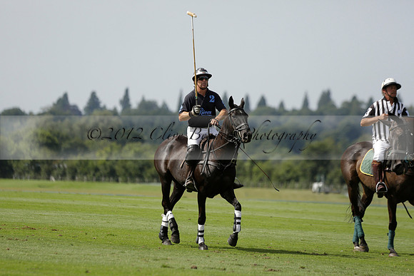 Maiz Dulce (green) v River (blue) in a Uber Polo Midsummer 12 goal polo match on Wednesday 21 August 2013 at Cowdray park Polo Club on Ambersham 2.  www.polopictures.co.uk