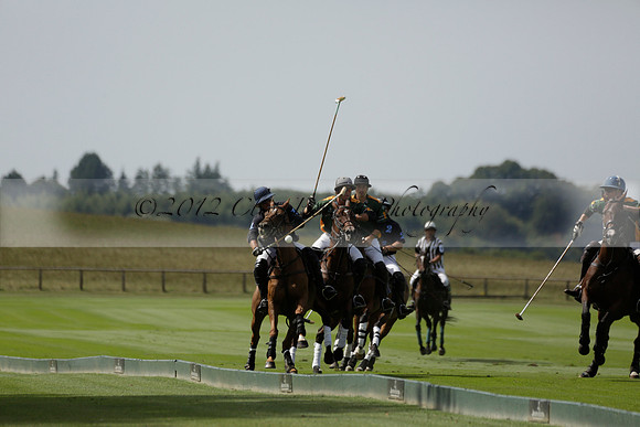 Maiz Dulce (green) v River (blue) in a Uber Polo Midsummer 12 goal polo match on Wednesday 21 August 2013 at Cowdray park Polo Club on Ambersham 2.  www.polopictures.co.uk