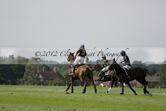 Maiz Dulce (green) v River (blue) in a Uber Polo Midsummer 12 goal polo match on Wednesday 21 August 2013 at Cowdray park Polo Club on Ambersham 2.  www.polopictures.co.uk