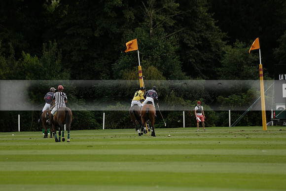 La Tremenda (lilac) v Maiz Dulce (yellow) in a Brecknock Cup polo match played on Lawns 1 at the Cowdray Park Polo Club on Tuesday 13 August 2013