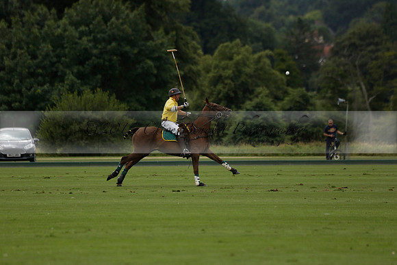La Tremenda (lilac) v Maiz Dulce (yellow) in a Brecknock Cup polo match played on Lawns 1 at the Cowdray Park Polo Club on Tuesday 13 August 2013