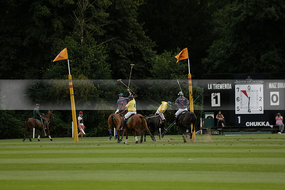 La Tremenda (lilac) v Maiz Dulce (yellow) in a Brecknock Cup polo match played on Lawns 1 at the Cowdray Park Polo Club on Tuesday 13 August 2013
