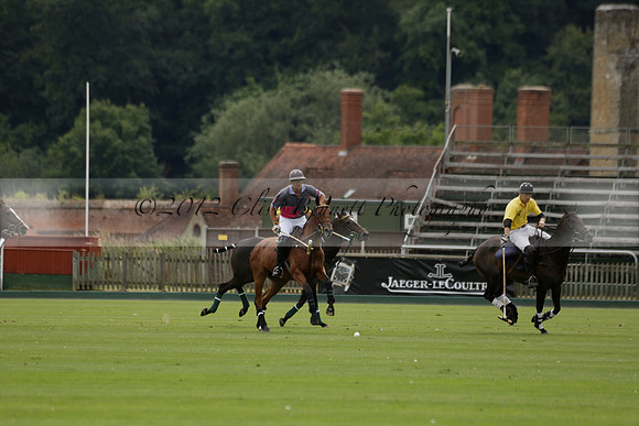 La Tremenda (lilac) v Maiz Dulce (yellow) in a Brecknock Cup polo match played on Lawns 1 at the Cowdray Park Polo Club on Tuesday 13 August 2013