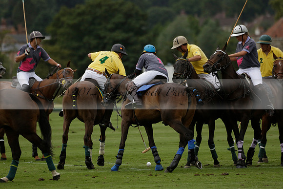 La Tremenda (lilac) v Maiz Dulce (yellow) in a Brecknock Cup polo match played on Lawns 1 at the Cowdray Park Polo Club on Tuesday 13 August 2013