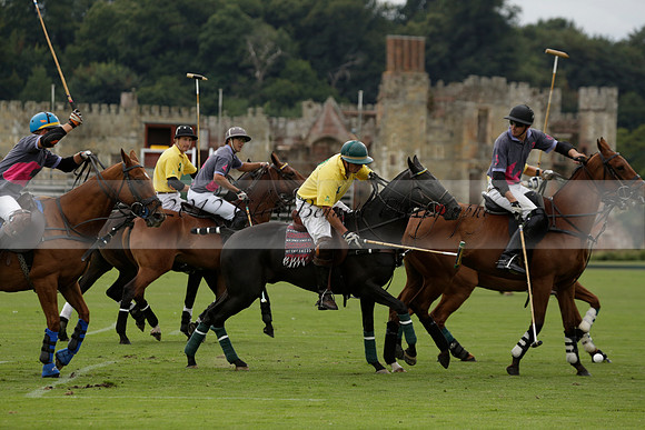 La Tremenda (lilac) v Maiz Dulce (yellow) in a Brecknock Cup polo match played on Lawns 1 at the Cowdray Park Polo Club on Tuesday 13 August 2013