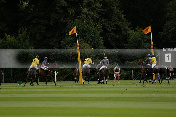 La Tremenda (lilac) v Maiz Dulce (yellow) in a Brecknock Cup polo match played on Lawns 1 at the Cowdray Park Polo Club on Tuesday 13 August 2013