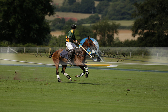 Maiz Dulce (green) v River (blue) in a Uber Polo Midsummer 12 goal polo match on Wednesday 21 August 2013 at Cowdray park Polo Club on Ambersham 2.  www.polopictures.co.uk