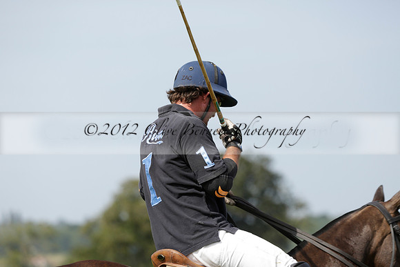 Maiz Dulce (green) v River (blue) in a Uber Polo Midsummer 12 goal polo match on Wednesday 21 August 2013 at Cowdray park Polo Club on Ambersham 2.  www.polopictures.co.uk
