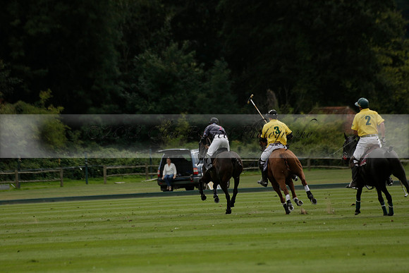 La Tremenda (lilac) v Maiz Dulce (yellow) in a Brecknock Cup polo match played on Lawns 1 at the Cowdray Park Polo Club on Tuesday 13 August 2013
