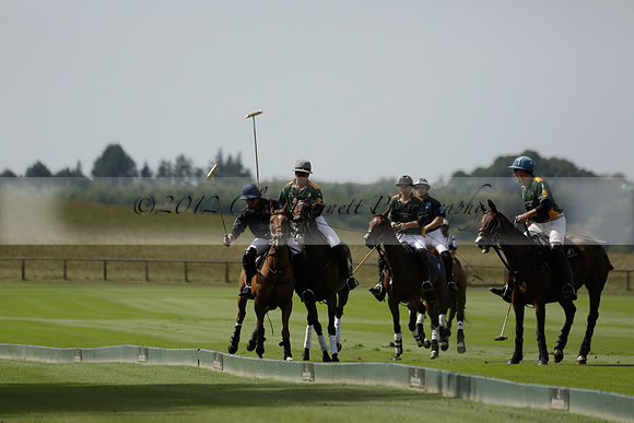 Maiz Dulce (green) v River (blue) in a Uber Polo Midsummer 12 goal polo match on Wednesday 21 August 2013 at Cowdray park Polo Club on Ambersham 2.  www.polopictures.co.uk