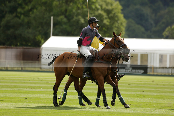 La Tremenda (lilac) v Maiz Dulce (yellow) in a Brecknock Cup polo match played on Lawns 1 at the Cowdray Park Polo Club on Tuesday 13 August 2013