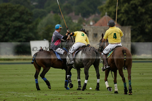 La Tremenda (lilac) v Maiz Dulce (yellow) in a Brecknock Cup polo match played on Lawns 1 at the Cowdray Park Polo Club on Tuesday 13 August 2013