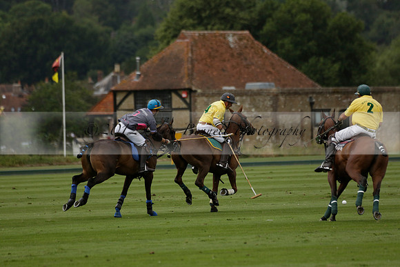La Tremenda (lilac) v Maiz Dulce (yellow) in a Brecknock Cup polo match played on Lawns 1 at the Cowdray Park Polo Club on Tuesday 13 August 2013