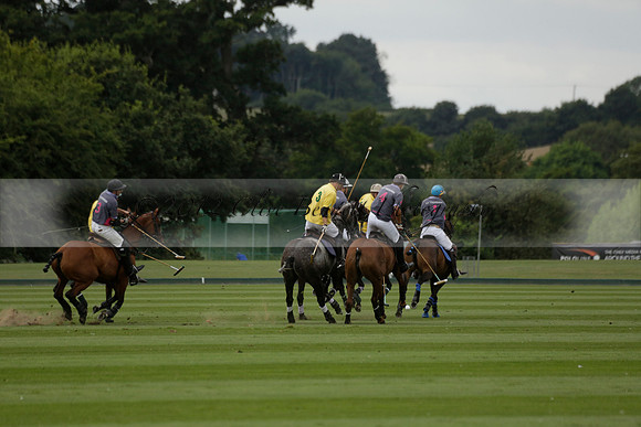 La Tremenda (lilac) v Maiz Dulce (yellow) in a Brecknock Cup polo match played on Lawns 1 at the Cowdray Park Polo Club on Tuesday 13 August 2013