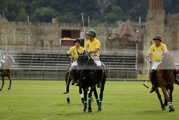 La Tremenda (lilac) v Maiz Dulce (yellow) in a Brecknock Cup polo match played on Lawns 1 at the Cowdray Park Polo Club on Tuesday 13 August 2013