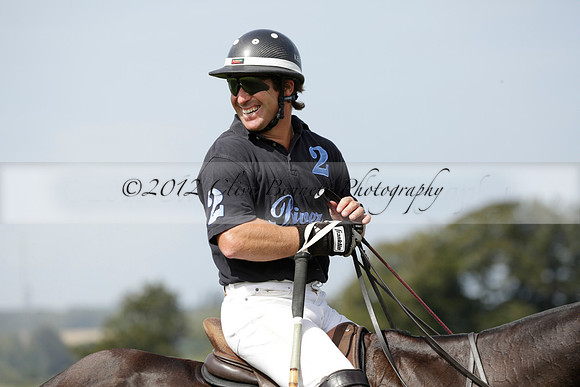 Maiz Dulce (green) v River (blue) in a Uber Polo Midsummer 12 goal polo match on Wednesday 21 August 2013 at Cowdray park Polo Club on Ambersham 2.  www.polopictures.co.uk