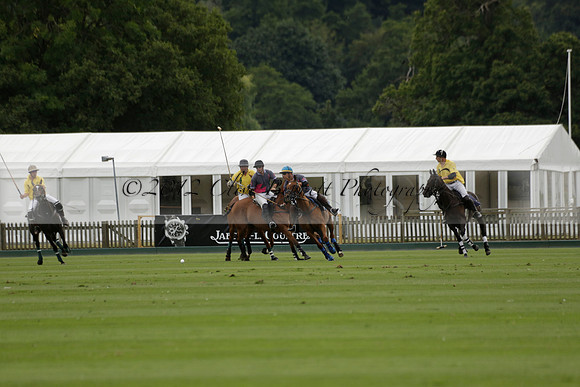 La Tremenda (lilac) v Maiz Dulce (yellow) in a Brecknock Cup polo match played on Lawns 1 at the Cowdray Park Polo Club on Tuesday 13 August 2013
