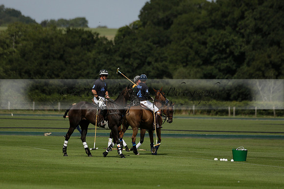 Maiz Dulce (green) v River (blue) in a Uber Polo Midsummer 12 goal polo match on Wednesday 21 August 2013 at Cowdray park Polo Club on Ambersham 2.  www.polopictures.co.uk
