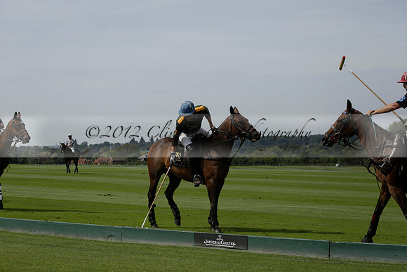 Maiz Dulce (green) v River (blue) in a Uber Polo Midsummer 12 goal polo match on Wednesday 21 August 2013 at Cowdray park Polo Club on Ambersham 2.  www.polopictures.co.uk