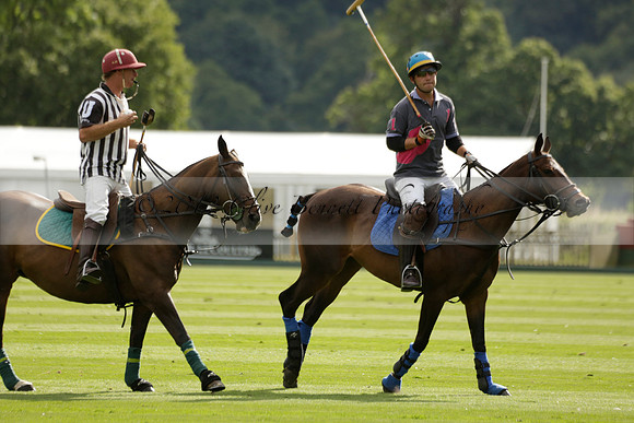 La Tremenda (lilac) v Maiz Dulce (yellow) in a Brecknock Cup polo match played on Lawns 1 at the Cowdray Park Polo Club on Tuesday 13 August 2013