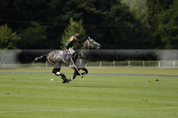 Maiz Dulce (green) v River (blue) in a Uber Polo Midsummer 12 goal polo match on Wednesday 21 August 2013 at Cowdray park Polo Club on Ambersham 2.  www.polopictures.co.uk