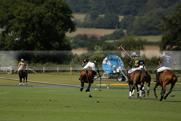 Maiz Dulce (green) v River (blue) in a Uber Polo Midsummer 12 goal polo match on Wednesday 21 August 2013 at Cowdray park Polo Club on Ambersham 2.  www.polopictures.co.uk