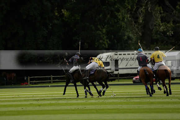 La Tremenda (lilac) v Maiz Dulce (yellow) in a Brecknock Cup polo match played on Lawns 1 at the Cowdray Park Polo Club on Tuesday 13 August 2013