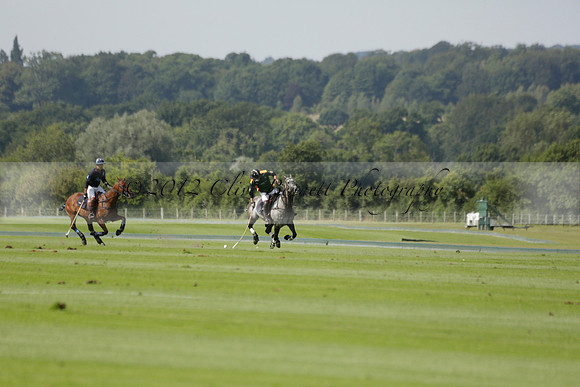 Maiz Dulce (green) v River (blue) in a Uber Polo Midsummer 12 goal polo match on Wednesday 21 August 2013 at Cowdray park Polo Club on Ambersham 2.  www.polopictures.co.uk