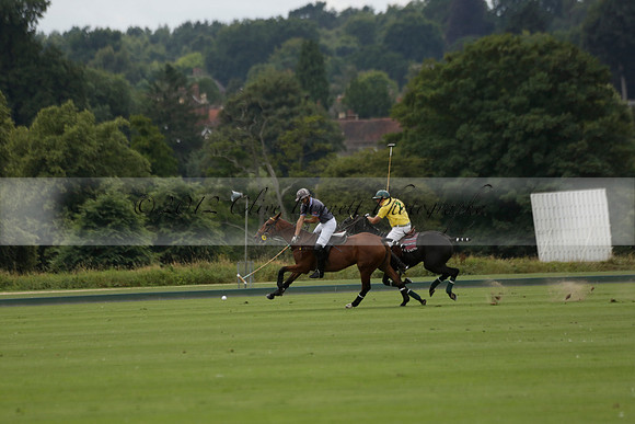 La Tremenda (lilac) v Maiz Dulce (yellow) in a Brecknock Cup polo match played on Lawns 1 at the Cowdray Park Polo Club on Tuesday 13 August 2013
