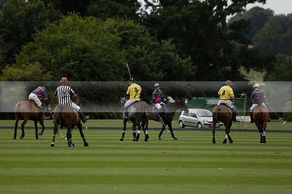 La Tremenda (lilac) v Maiz Dulce (yellow) in a Brecknock Cup polo match played on Lawns 1 at the Cowdray Park Polo Club on Tuesday 13 August 2013