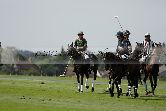 Maiz Dulce (green) v River (blue) in a Uber Polo Midsummer 12 goal polo match on Wednesday 21 August 2013 at Cowdray park Polo Club on Ambersham 2.  www.polopictures.co.uk