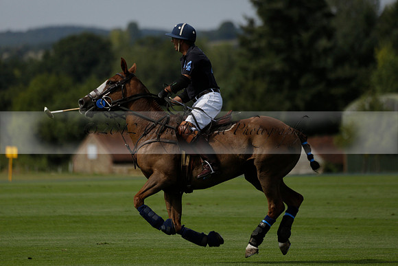 Maiz Dulce (green) v River (blue) in a Uber Polo Midsummer 12 goal polo match on Wednesday 21 August 2013 at Cowdray park Polo Club on Ambersham 2.  www.polopictures.co.uk