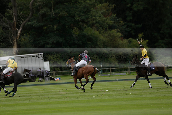 La Tremenda (lilac) v Maiz Dulce (yellow) in a Brecknock Cup polo match played on Lawns 1 at the Cowdray Park Polo Club on Tuesday 13 August 2013